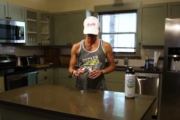 Hollie preparing a glass of KSPtabs in her kitchen