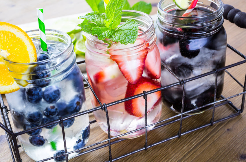 Fruit-infused water recipe ideas for summer hydration — orange blueberry, strawberry mint, and blackberry cucumber