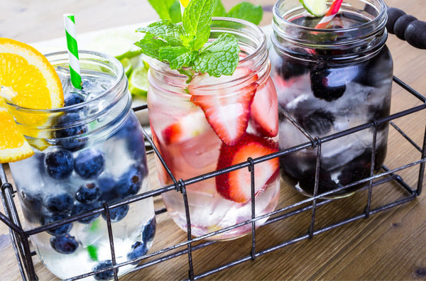Fruit-infused water recipe ideas for summer hydration — orange blueberry, strawberry mint, and blackberry cucumber